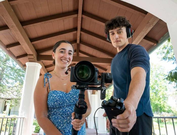 Students with filming equipment